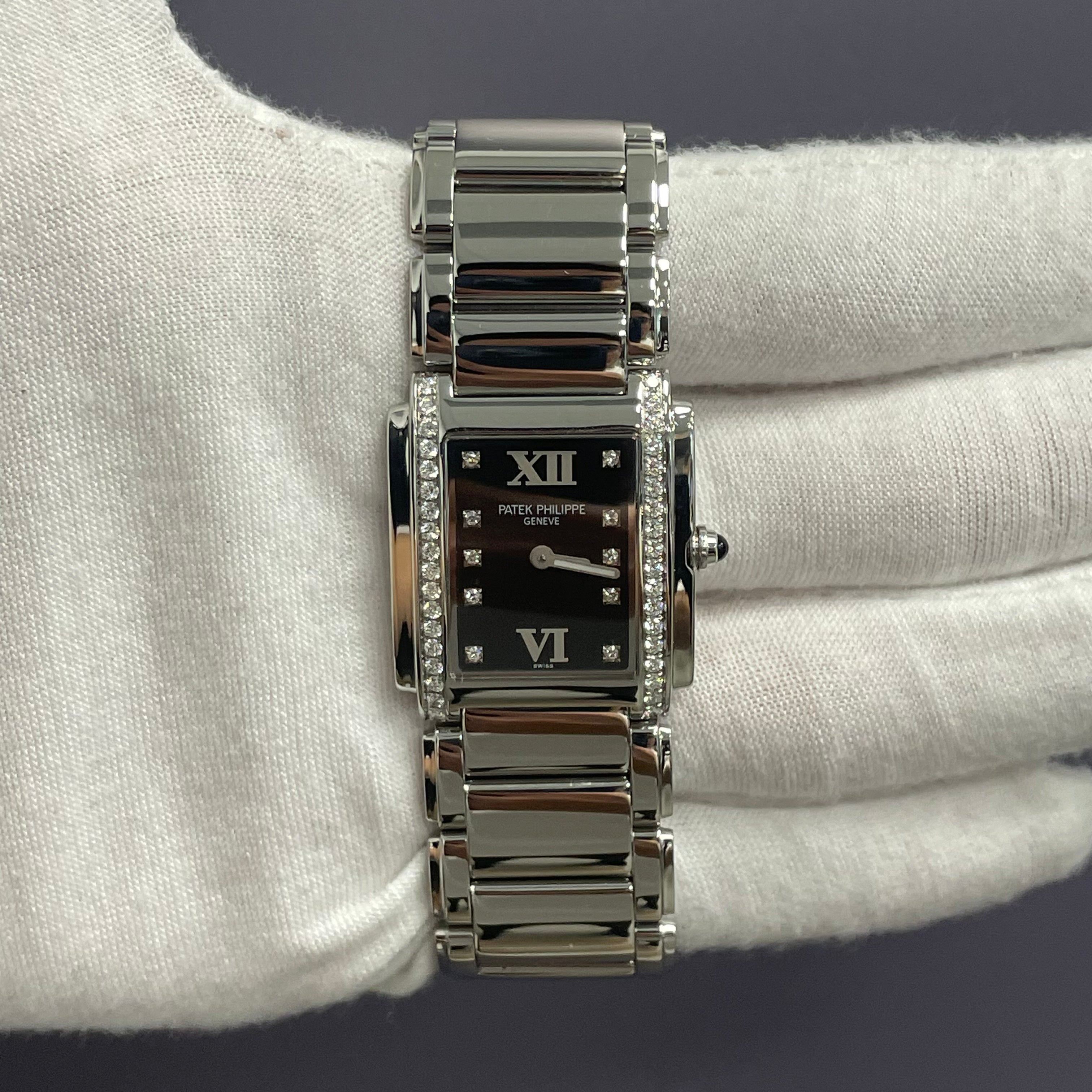 Patek Philippe Twenty-4 25mm Black Dial Watch Ref# 4910/10A-001 - Happy Jewelers Fine Jewelry Lifetime Warranty