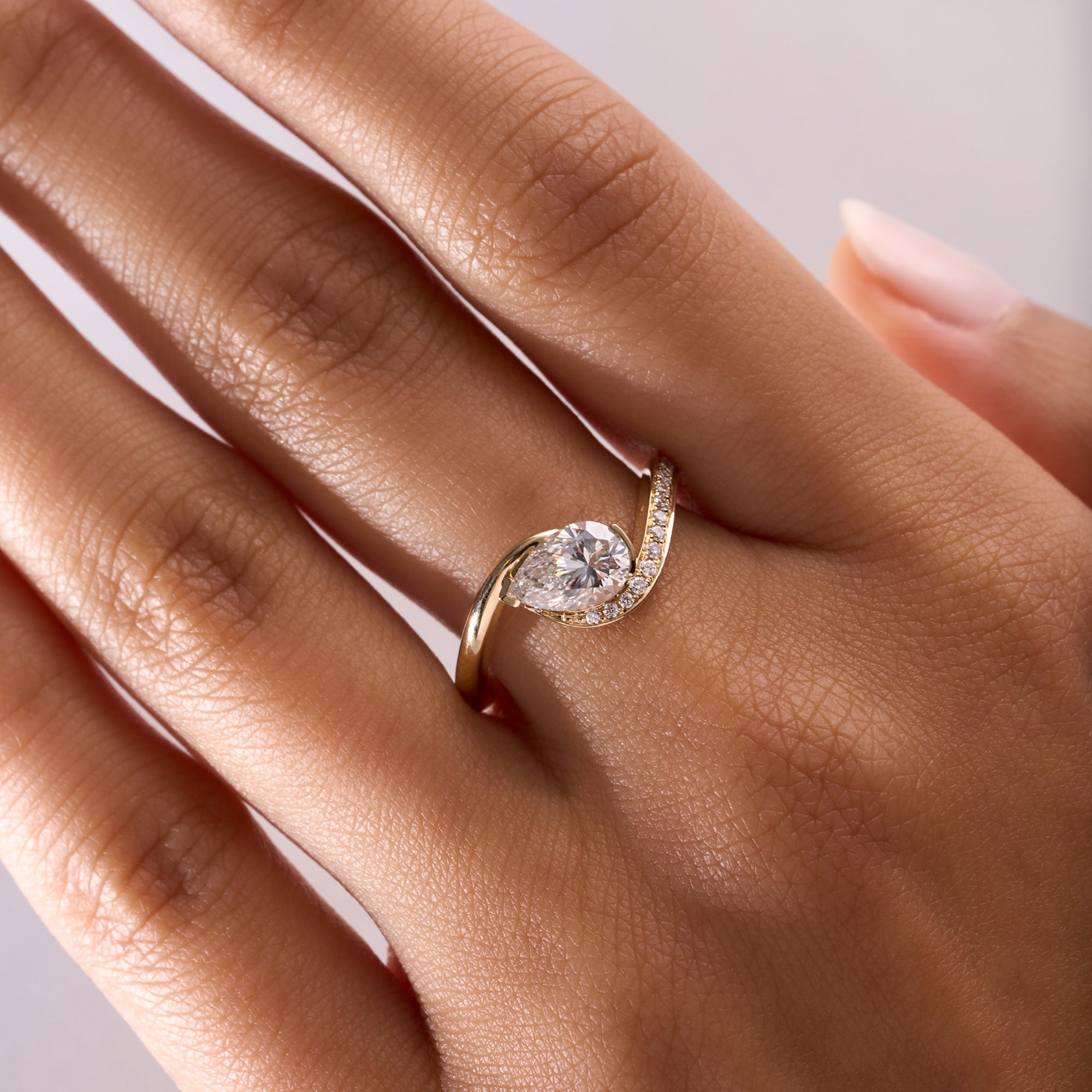 Pear Halfway Motion Solid and Diamond Ring