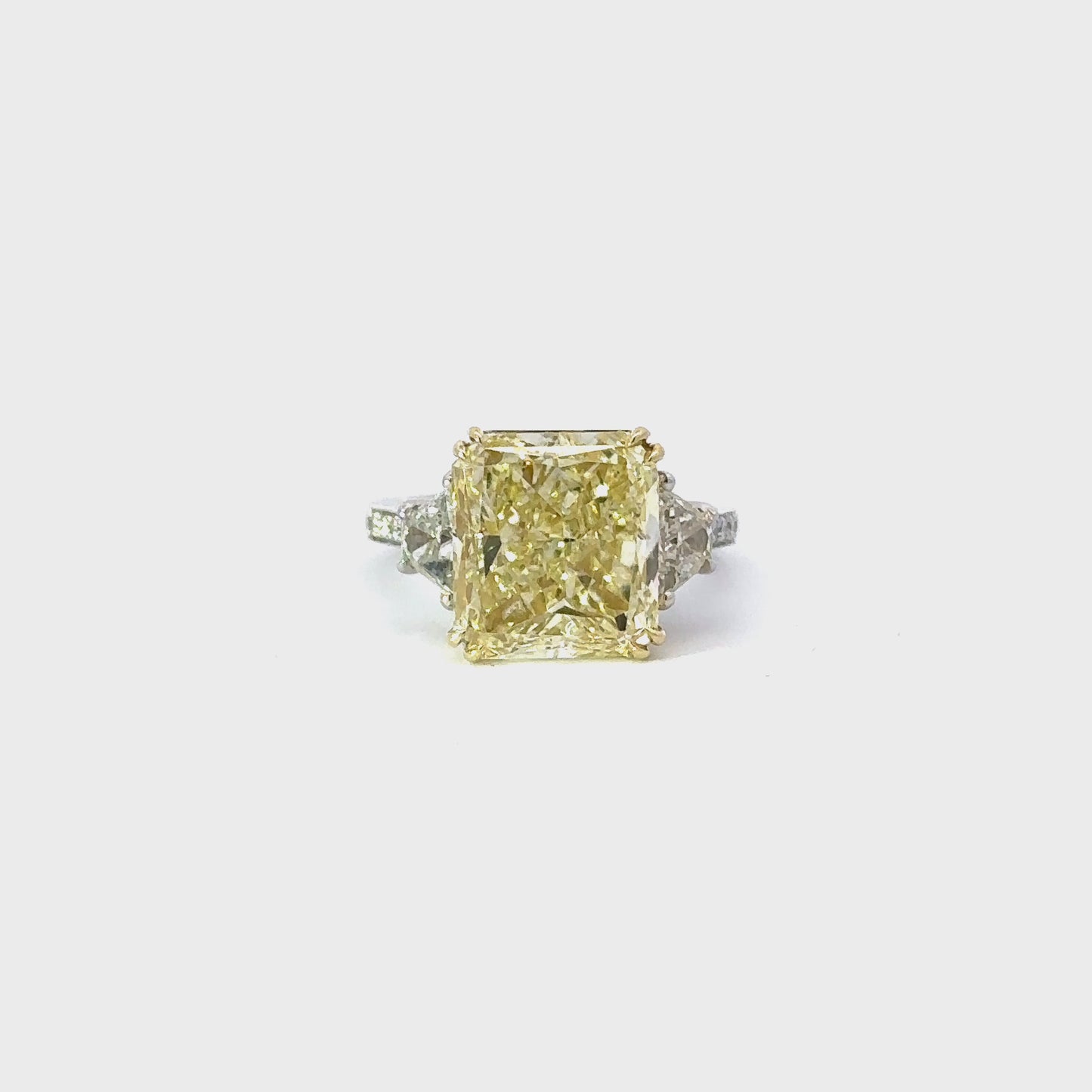 Load and play video in Gallery viewer, 8.04 Carat Fancy Yellow Radiant Natural Diamond 3 Stone Engagement Ring
