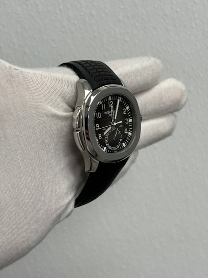 Patek Philippe Aquanaut Travel Time Stainless Steel 40mm Black Arabic Dial Watch Reference# 5164A-001 - Happy Jewelers Fine Jewelry Lifetime Warranty