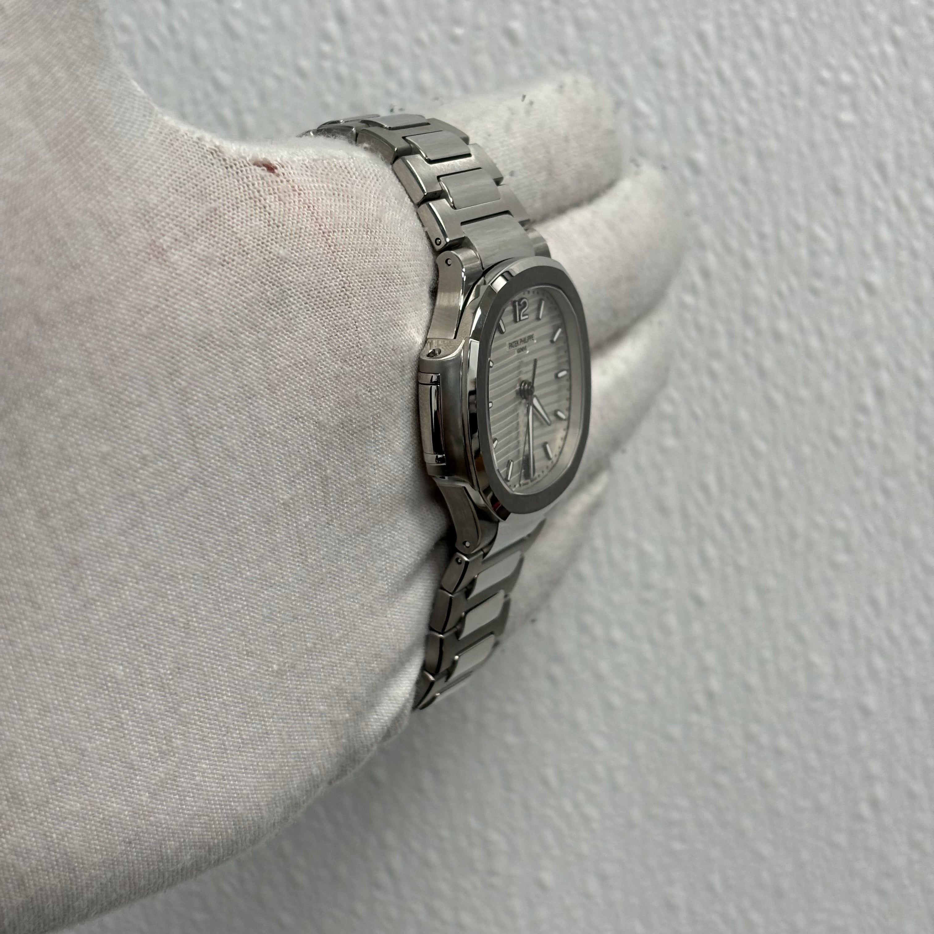 Patek Philippe Lady Nautilus 35.2mm Silver Opaline Dial Watch Ref# 7118/1A-010 - Happy Jewelers Fine Jewelry Lifetime Warranty