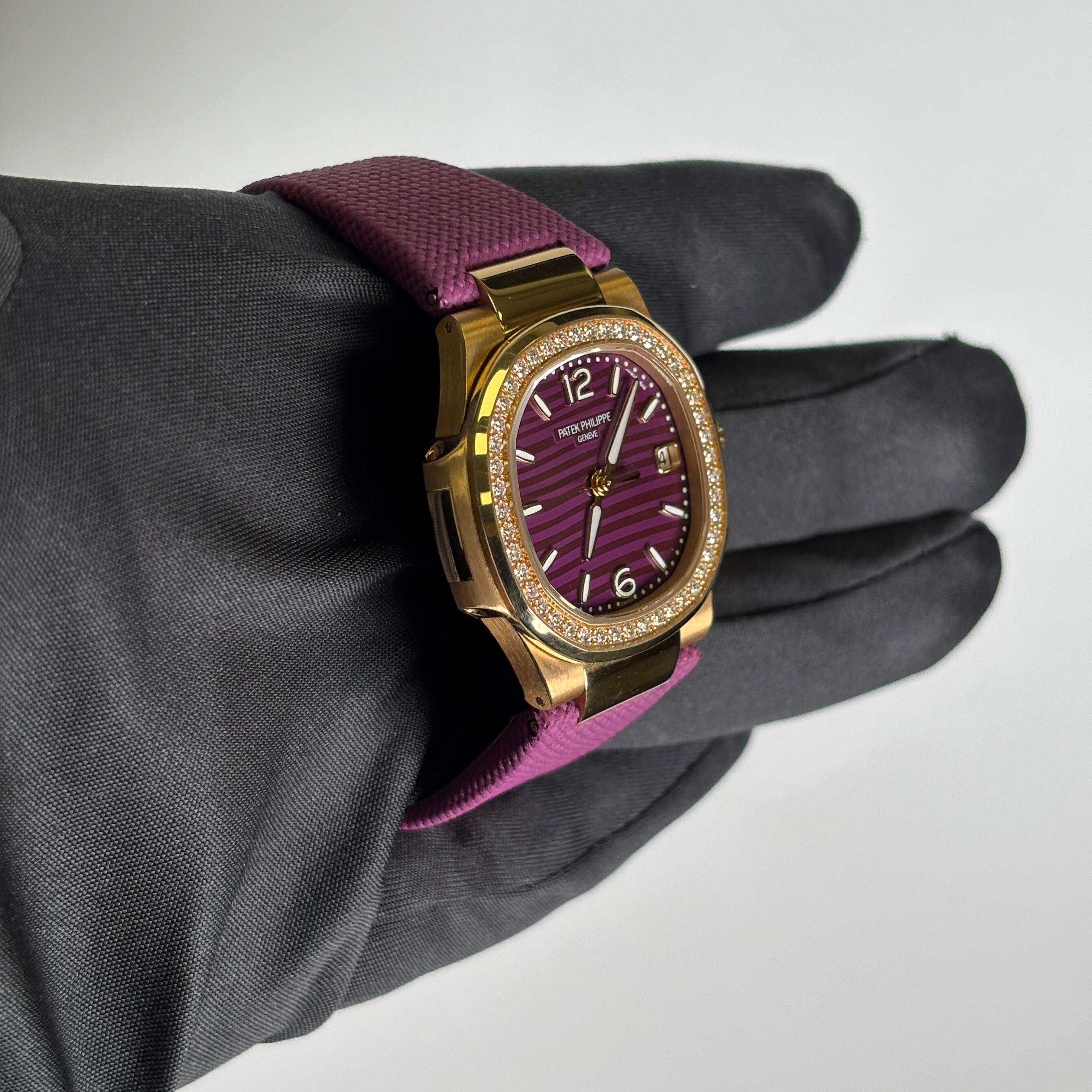 Patek Philippe Nautilus 32mm Purple Dial Watch Ref# 7010R-013 - Happy Jewelers Fine Jewelry Lifetime Warranty