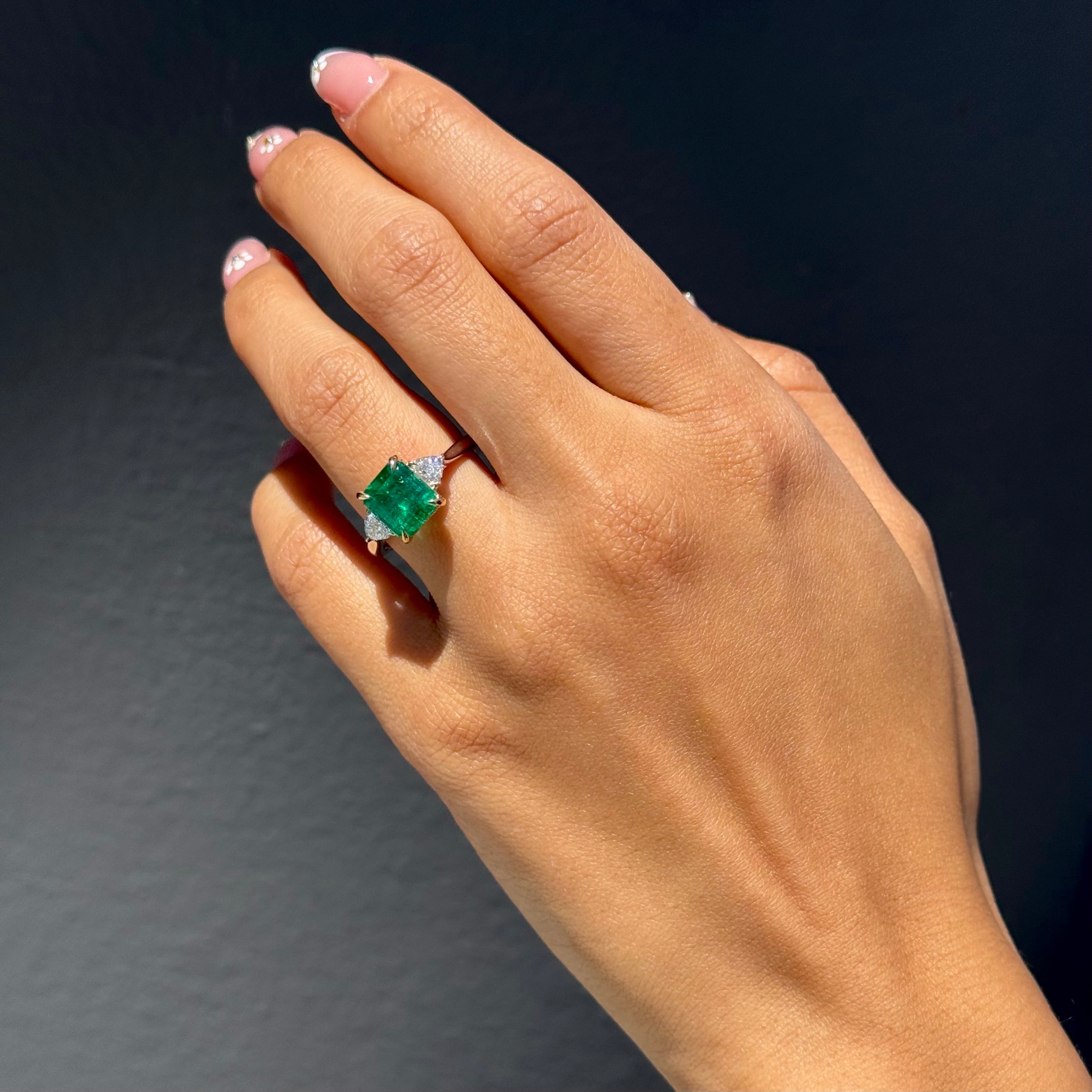 Emerald 3 Stone with Trilliant Diamond Sidestones Ring