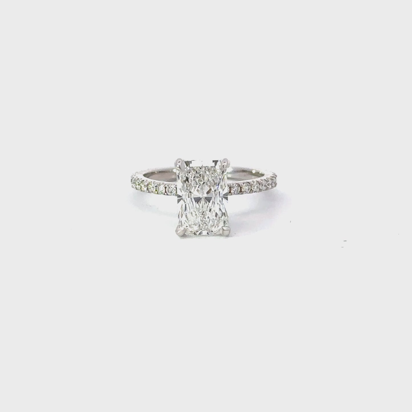 Load and play video in Gallery viewer, 2.10 Carat Lab Created Radiant Engagement Ring with Signature Setting
