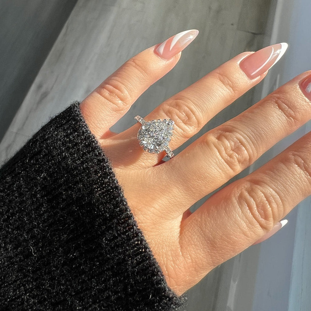 4 carat pear shaped diamond ring on hand Clearance